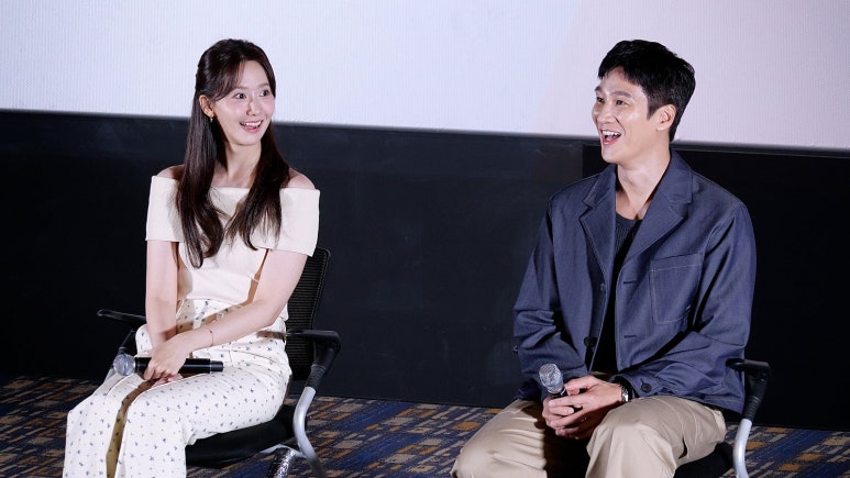 YoonA laughing with Ahn Bo Hyun during Pretty Crazy stage greeting, capturing audience love driving the box office comeback