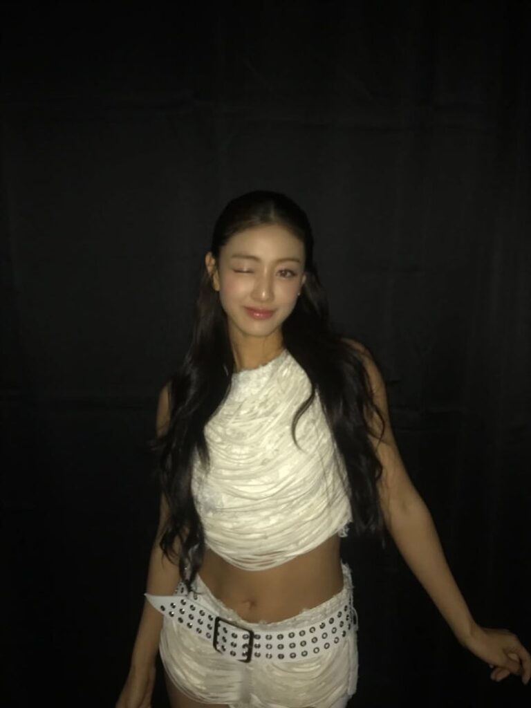Jihyo winks at camera backstage in Fukuoka, smiling after overcoming her health issue on stage
