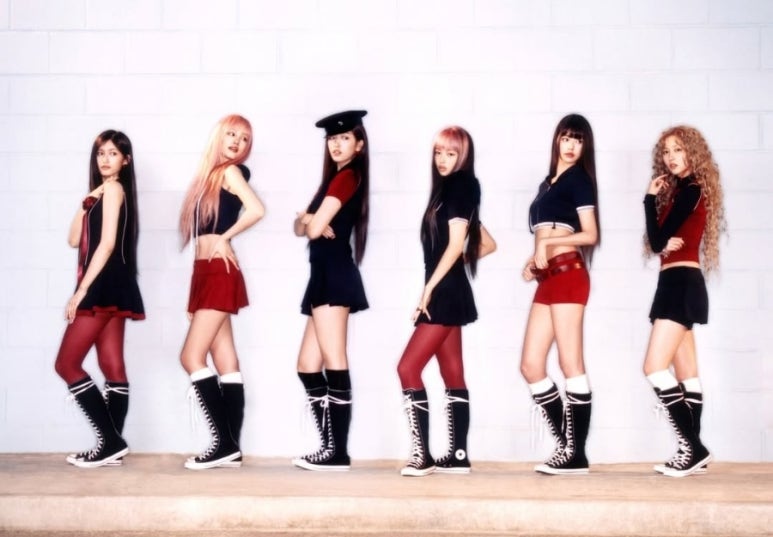 IVE SECRET promotional photo highlighting IVE’s unique group fashion with knee-high lace-up boots.