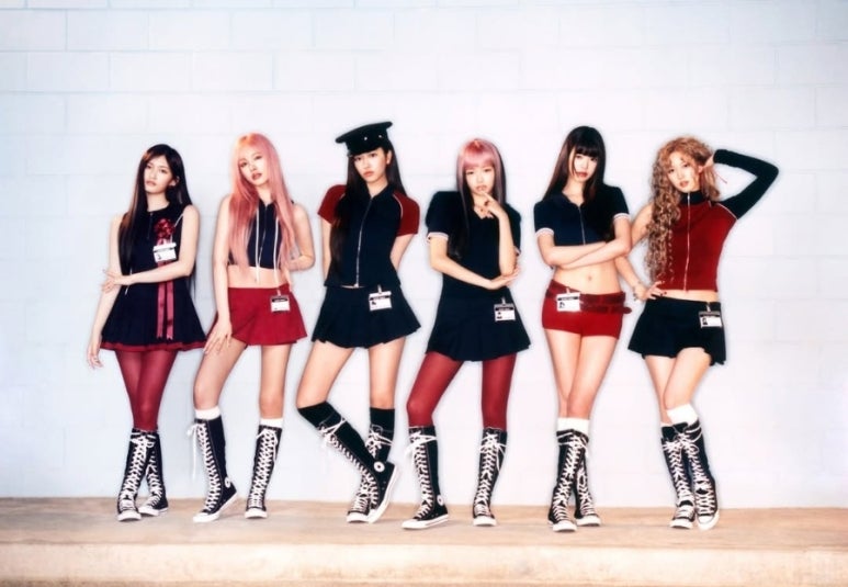 IVE SECRET teaser image showing IVE members sitting in formation with powerful stares and dark styling.