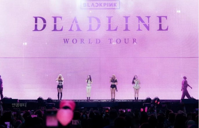 BLACKPINK performs under pink lighting during DEADLINE World Tour, teasing their 2025 comeback album