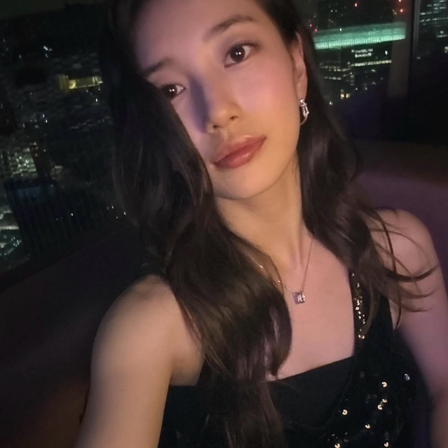 Suzy at night with city lights, linked to Suzy marriage rumor speculation