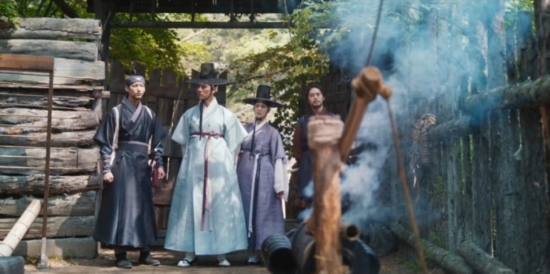 Tyrant Chef drama scene with Joseon scholars entering wooden gate surrounded by smoke