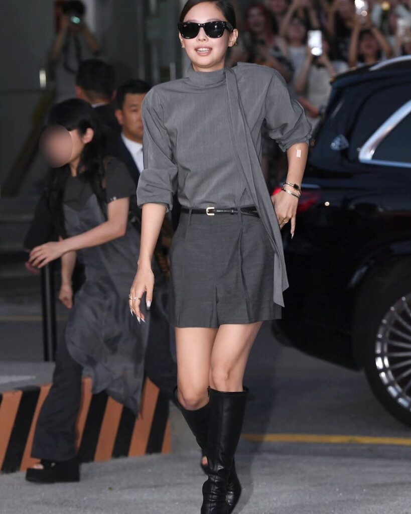 Jennie striding into venue in gray outfit, crowd of fans behind her cheering — Jennie RIAA certifications