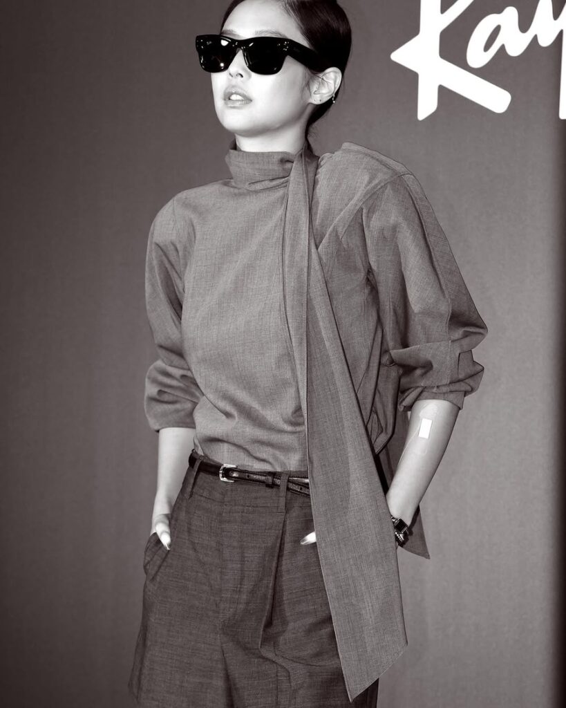 Black and white photo of Jennie in monochrome fashion at Ray-Ban event, exuding elegance — Jennie RIAA certifications