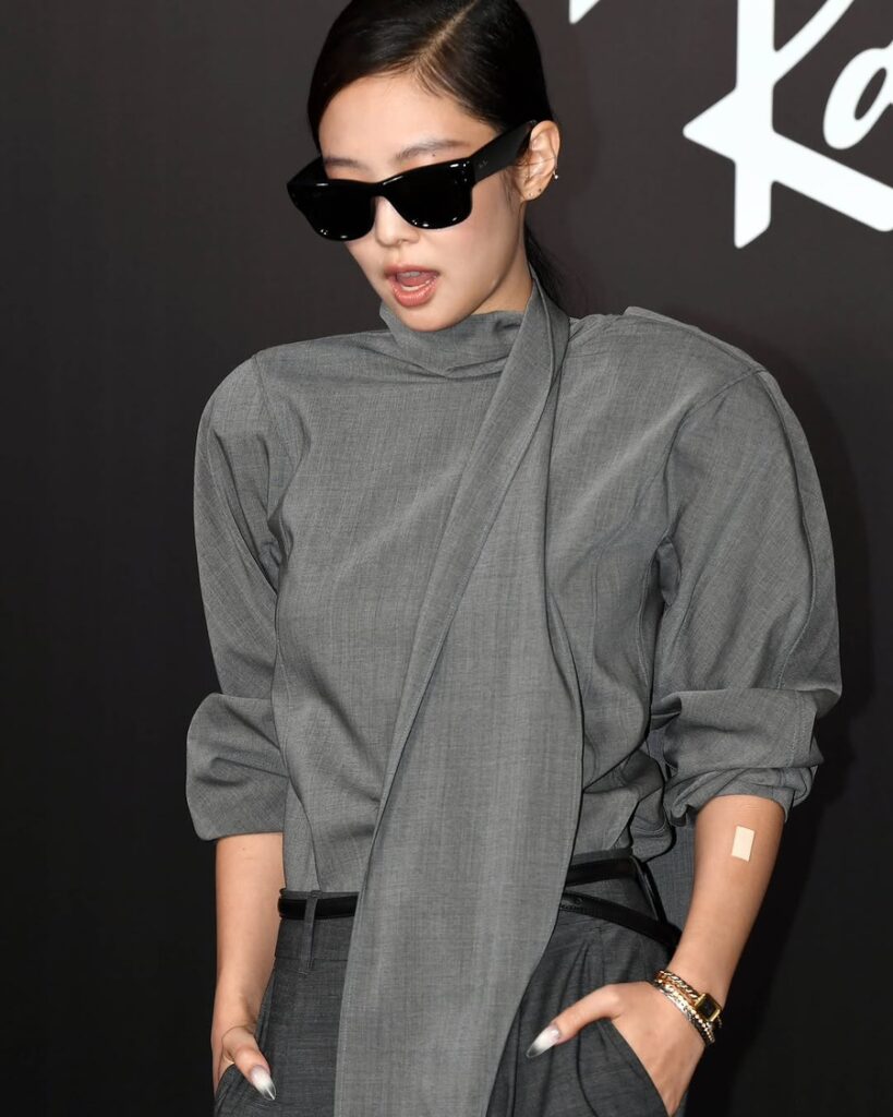 Jennie makes a surprised expression on the red carpet, blending sophistication with charm — Jennie RIAA certifications
