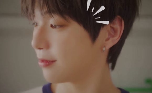 Close-up of Kang Daniel with surprised expression, staying strong after Los Angeles robbery.