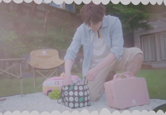 Kang Daniel organizing picnic supplies, showing calm demeanor after Kang Daniel robbery in Los Angeles.