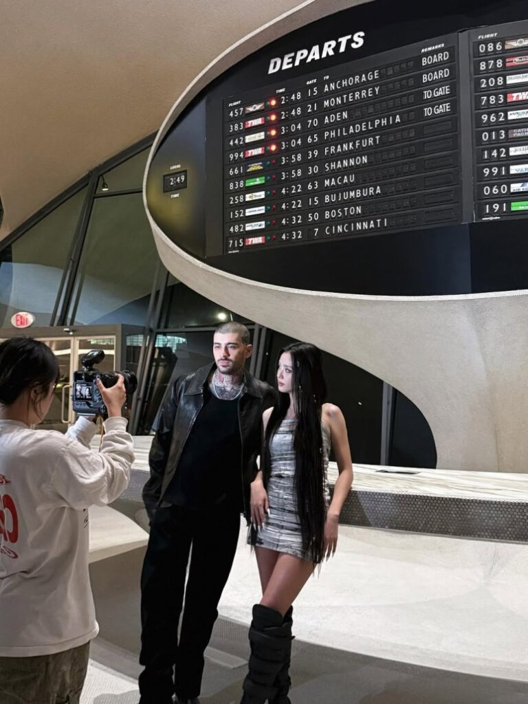 Behind-the-scenes look at Jisoo and Zayn during Eyes Closed promo shoot at airport-themed set