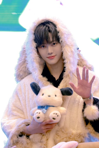 NCT DREAM Beat It Up teaser cute member in fluffy bear outfit holding a plush toy on fan event stage