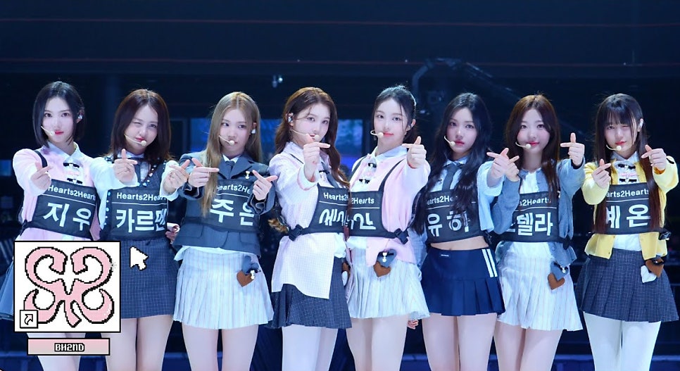 Hearts2Hearts members in gray school uniforms posing dramatically ahead of FOCUS release, boosting Hearts2Hearts FOCUS first week sales