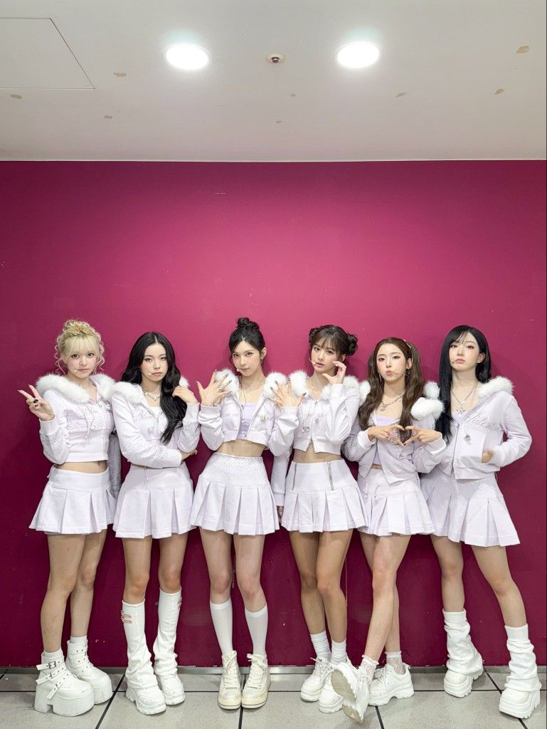 Nmixx in lavender stage outfits before performing Blue Valentine live