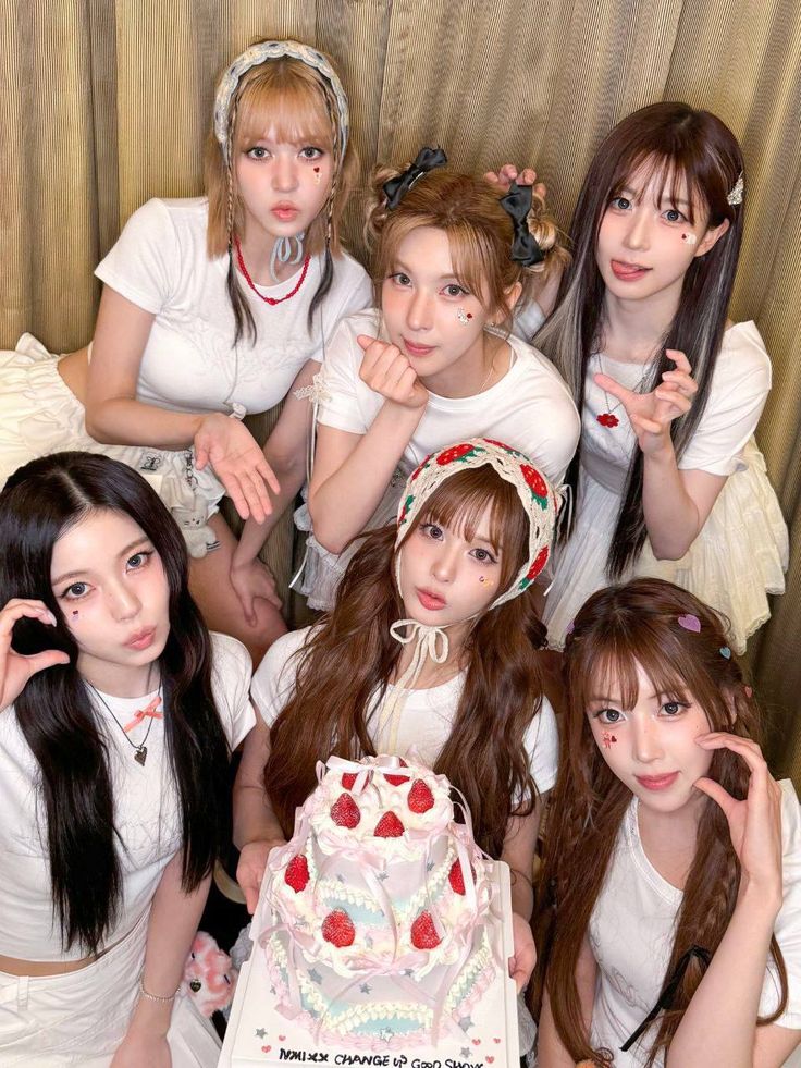 Nmixx celebrates Blue Valentine win with strawberry cake and playful expressions