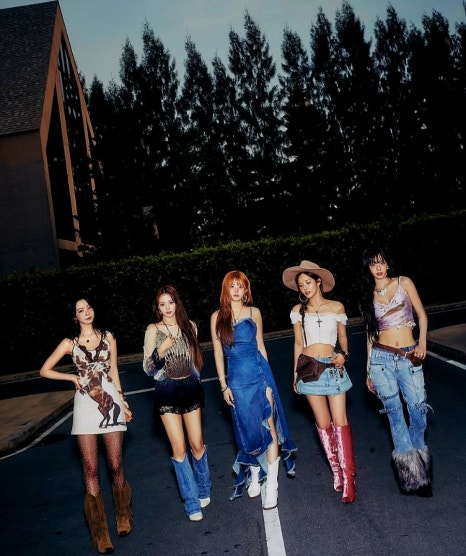 Dynamic full-body shot of <strong>fromis_9 December comeback</strong> members in confident, western-themed outfits.