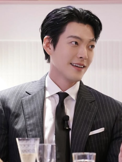 Kim Woo-Bin smiling during a recent interview, ahead of his upcoming wedding with Shin Min-Ah.