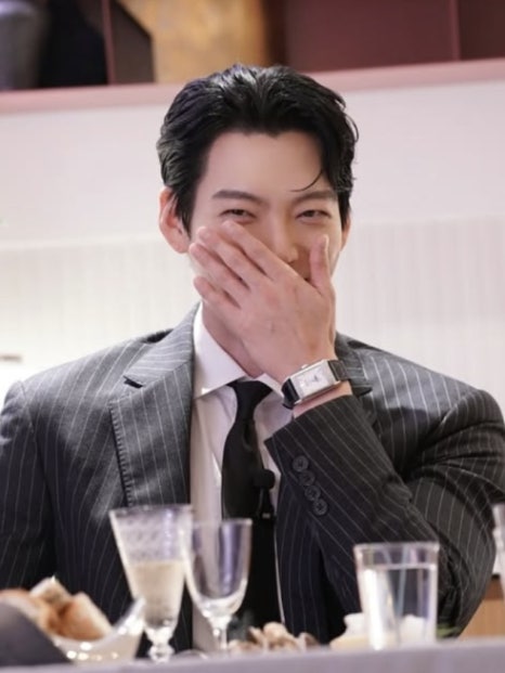 Shin Min-Ah holding a bouquet in a serene moment, possibly hinting at wedding-themed shoots.