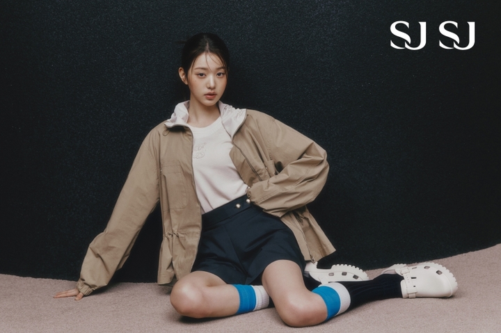 IVE’s Jang Wonyoung in sporty chic style with beige jacket, high-waisted navy shorts and long socks in SJ SJ fashion shoot