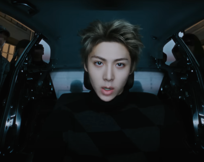 ALLDAY PROJECT comeback teaser featuring male idol with messy blonde hair in a car set