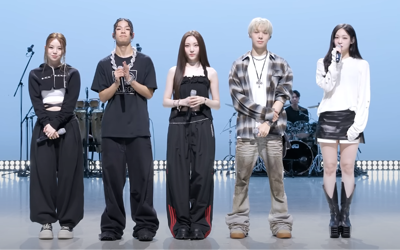 ALLDAY PROJECT members standing on stage in rehearsal outfits — comeback live showcase lineup