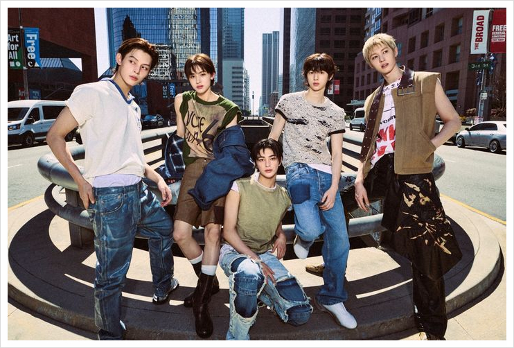 Full daylight group shot of CORTIS in the city center, emphasizing their urban K-pop debut aesthetic.