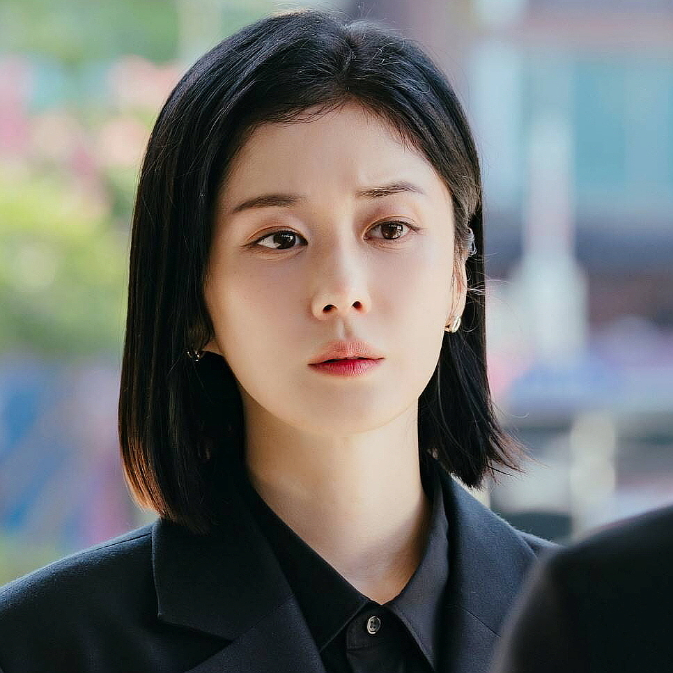 Close-up of Taxi Driver 3 villain Jang Na Ra with serious expression in outdoor setting